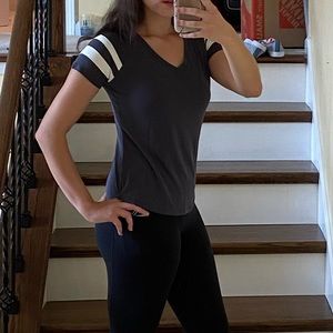 dark gray short sleeved shirt with sleeve stripes